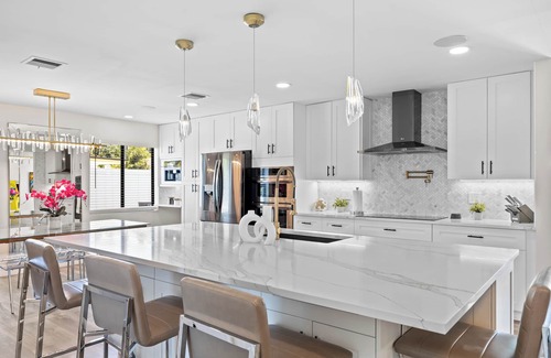 Tropic Palms House | Luxe Coastal Retreat - 4BR w/Pool, Hot Tub, Arcade & Work Space - 3 mi to beach