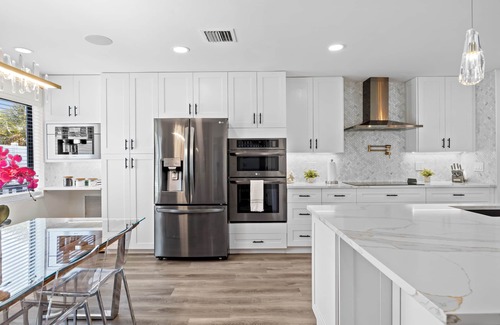 Tropic Palms House | Luxe Coastal Retreat - 4BR w/Pool, Hot Tub, Arcade & Work Space - 3 mi to beach