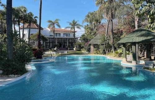 Nueva Andalucia Villa | Luxurious 10-Bed Oasis: Pool, Garden & Glamour!