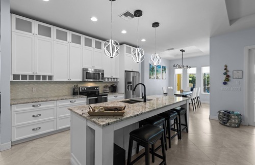 Fort Pierce House | Luxurious 4-Bedroom Pool Home -Walk to Beach & Restaurants