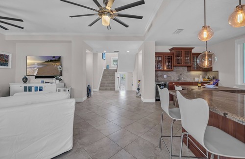 Stillwright Point House | Luxurious tropical water-front Heated pool home with Boat Dock and two master .