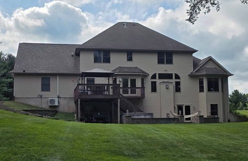 Geneseo House | Luxury 5 BR home on private wooded lot near QC, w/hot tub, rec & fitness room