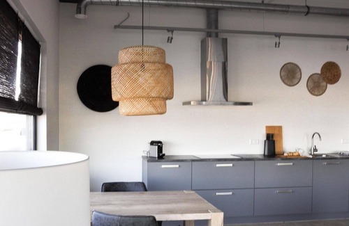 Stellendam House | Luxury apartment with private terrace, spacious living room, and stunning views of the marina.