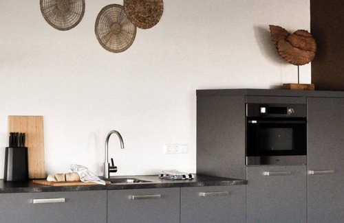 Stellendam House | Luxury apartment with private terrace, spacious living room, and stunning views of the marina.