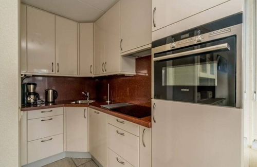 Oude-Tonge House | Luxury holiday home with fully hardened waterfront terrace. The long outdoor table under the terrace