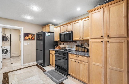 Lake Worth House | Luxury Lakefront Retreat with Heated Pool, Tiki Lounge, Dock, Gym & EV Charger