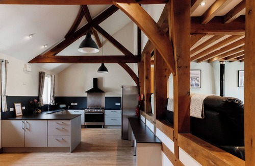 Devils Bridge House | Luxury renovated barn in the countryside, with10 bedrooms and 10 bathrooms. Including a large hot tub/rehab spa, full size football pitch, games room and electric car charging.