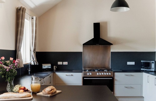 Devils Bridge House | Luxury renovated barn in the countryside, with10 bedrooms and 10 bathrooms. Including a large hot tub/rehab spa, full size football pitch, games room and electric car charging.