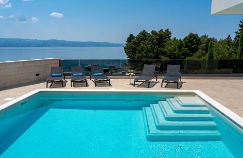 Omis Villa | Luxury, seafront Villa Petra with heated pool only 50m from beach
