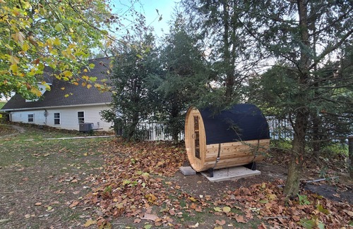 Fertility Cottage | Luxury Waterfront Cottage with Wood Burning Fireplace + Hot Tub + Backyard Sauna