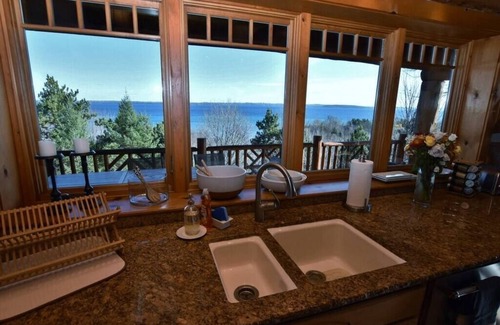 Suttons Bay House | Luxury Waterfront Log Home 15 min from Traverse City w/Dock