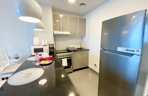 Jumeirah Village Triangle Apartment | Marco Polo - Pastel Studio with Stunning Aerial City Views