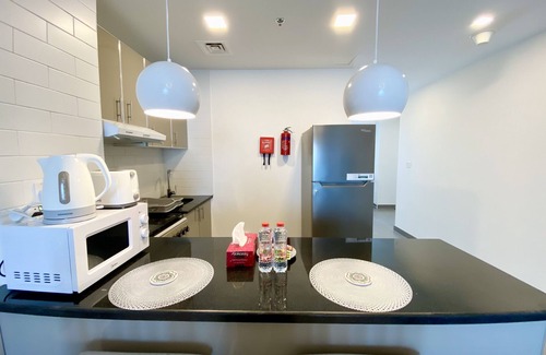 Jumeirah Village Triangle Apartment | Marco Polo - Pastel Studio with Stunning Aerial City Views