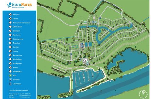 Olburgen House | Marina Strandbad Chalet Land in Sicht mit Zaun Haus Nr 81