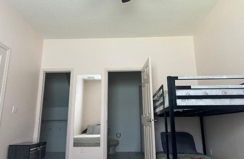 Southeast Orlando House | Master bedroom next to the airport