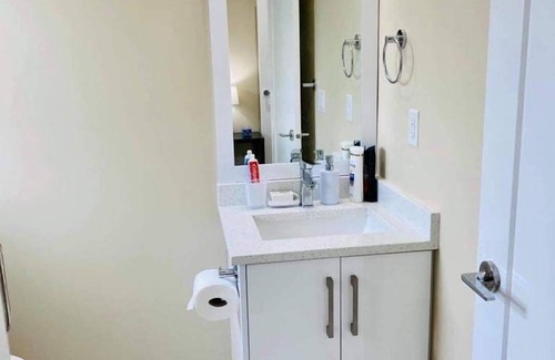 Queensborough House | Master bedroom with private bathroom in New home