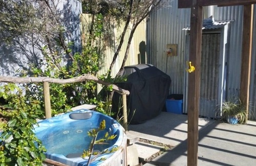 Whangaripo Ski Chalet | Matakana peaceful rustic retreat,soak in the secluded hot spa.