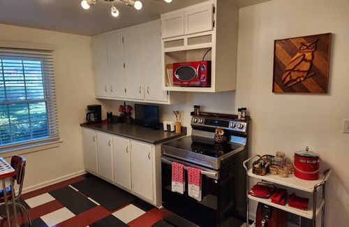 Godfrey House | Mid century + boho getaway on a quiet road in Godfrey. 2BR, 1 BA. WiFi included.