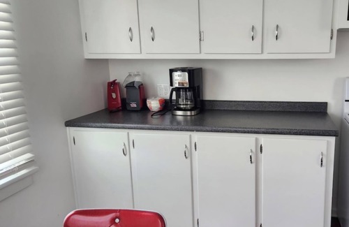 Godfrey House | Mid century + boho getaway on a quiet road in Godfrey. 2BR, 1 BA. WiFi included.