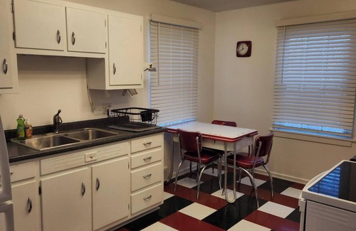 Godfrey House | Mid century + boho getaway on a quiet road in Godfrey. 2BR, 1 BA. WiFi included.