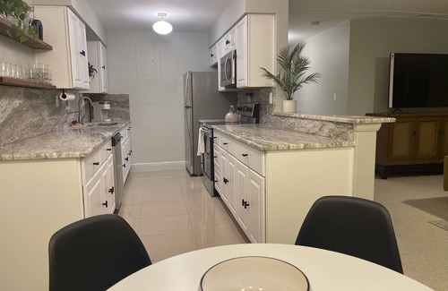 East Naples House | Midcentury Rambler with large backyard and open patio.