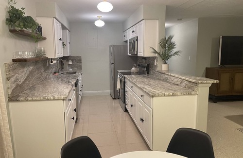 East Naples House | Midcentury Rambler with large backyard and open patio.