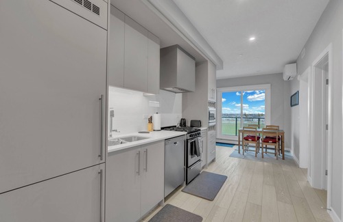 West Springs Condo | Modern 2BR Suite with Underground Parking in SW Calgary