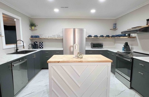 Decatur House | Modern 4BR Retreat Games Fire Pit Movie Room