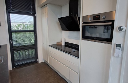 Olburgen House | Modern chalet with fenced garden, sauna, outdoor pool and river view in Olburgen