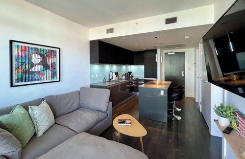 East Village Condo | Modern High-Rise w/Projector, Firetable, Gym & Underground Parking