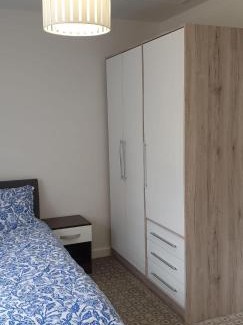 Little Hulton Apartment | Modern Home with Private Garden and Car Park in Manchester