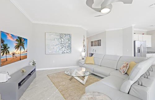 Naples House | Modern waterfront home in Artesia with pool/gym