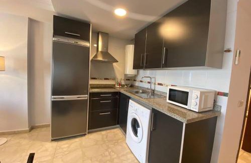 Caleta de Velez Apartment | Moderno Apartamento en primera linea de playa con terraza y vistas al mar- Caleta del Puerto