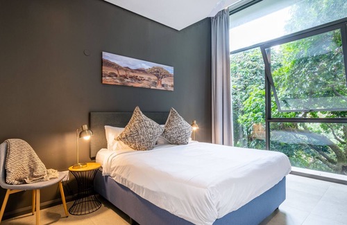 Salt Rock Apartment | Moody Modern Coastal Forest Condo