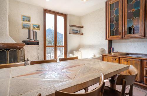 Barzio Apartment | Mountain lodging with fireplace and mountain view
