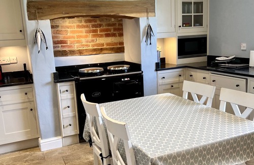 Newport House | Multi-award winning Georgian Farmhouse, village location, short walk to beach