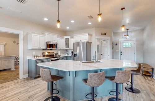 Crestview House | Nautical-themed retreat with a saltwater pool, fire table, full kitchen, and AC