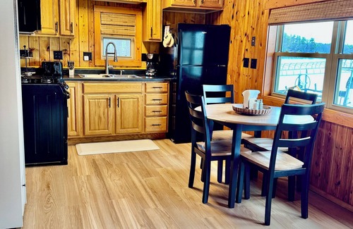 Spooner Cottage | NEW 2 Cottages on the Lake Spooner WI Steps from sand of McKenzie Lake Sleeps 12