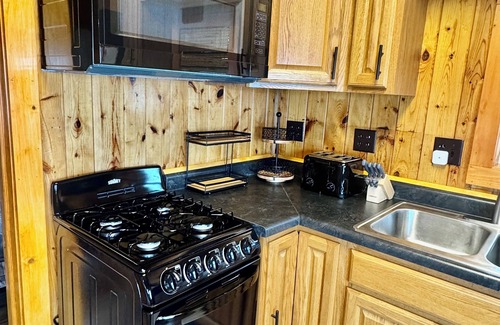 Spooner Cottage | NEW 2 Cottages on the Lake Spooner WI Steps from sand of McKenzie Lake Sleeps 12