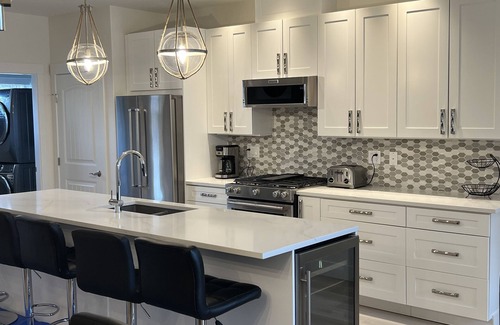 Westbank Condo | New Beautiful Lakefront 1400 sq ft, 2 BR + Den, 2 Level ground floor walk out.