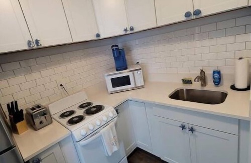 Tequesta Apartment | New Bedroom, Kitchen and Bathroom with a Pool