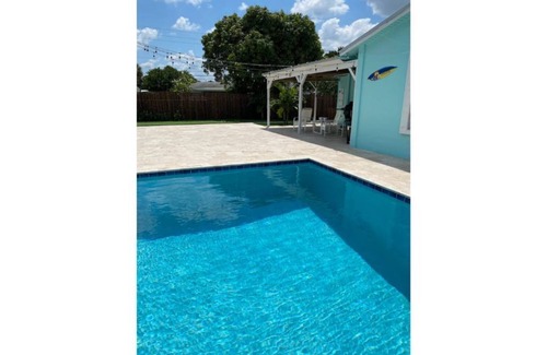 Tequesta Apartment | New Bedroom, Kitchen and Bathroom with a Pool