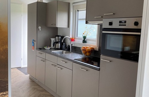 Municipality of Kampen House | NEW Elegant Holiday Home Chalet on a Lake in Kampen, Netherlands Boat waterfront