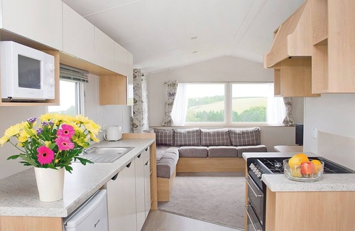 Looe House | New in 2017, 2018 and 2019. 12ft-wide superior caravan with one double and two twin.