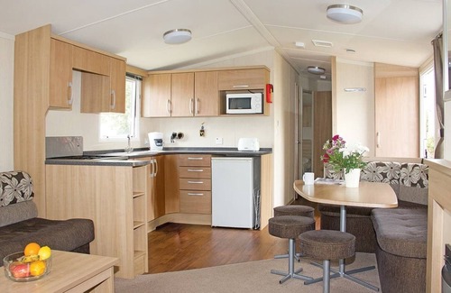 Looe House | New in 2017, 2018 and 2019. 12ft-wide superior caravan with one double and two twin.