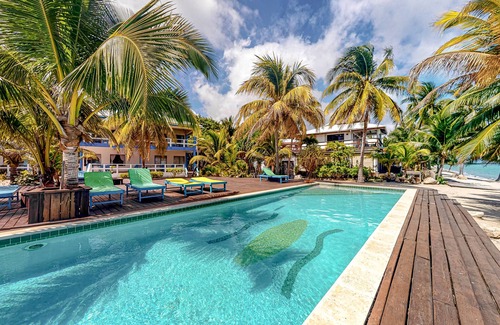 Placencia Condo | Ocean view condo at beachfront complex with AC, free WiFi, & pool