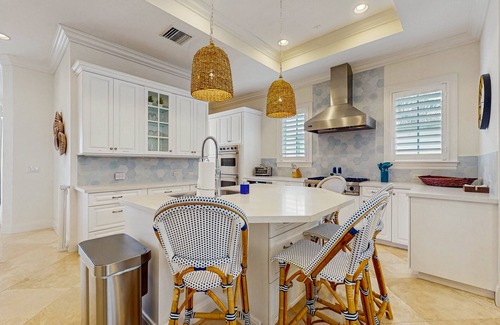 Ocean Ridge House | Ocean view estate w/in ground outdoor pool, breezy terraces, and covered lanai