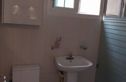 Wanju House | Olive Wanju Pension