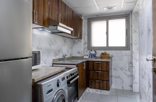 Al Muraqqabat House | One Bedroom Apartment Near Al Shamsi Building By Luxury Bookings
