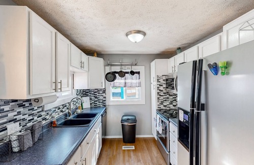 Avoca House | One-of-a-kind retreat with home theater, indoor basketball, private pool, & gym